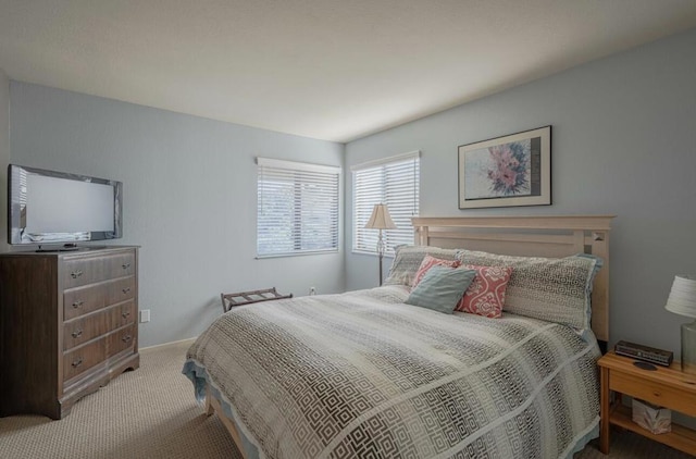 bedroom with light colored carpet