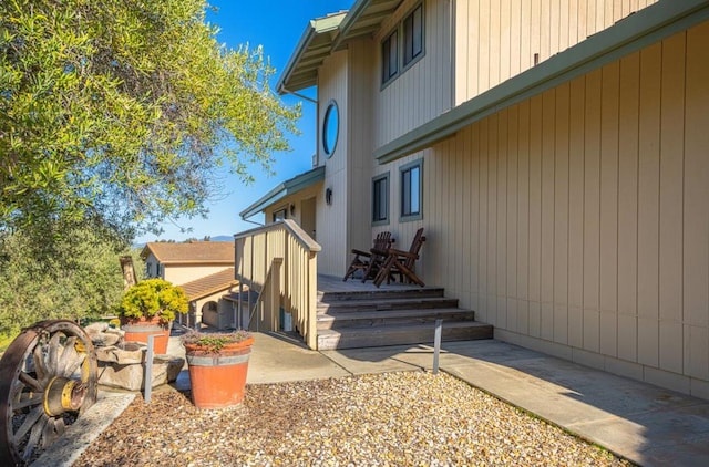 view of side of home with a patio area