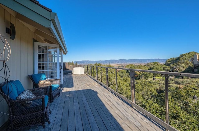 wooden deck with a mountain view