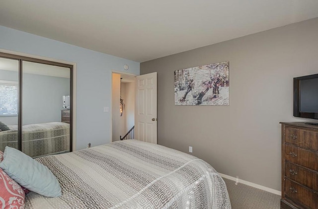 bedroom featuring carpet floors and a closet