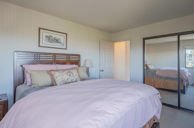 carpeted bedroom with a closet