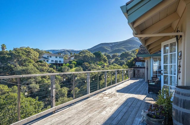 wooden deck featuring a mountain view