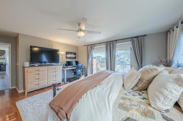 bedroom featuring ceiling fan, wood-type flooring, and access to exterior