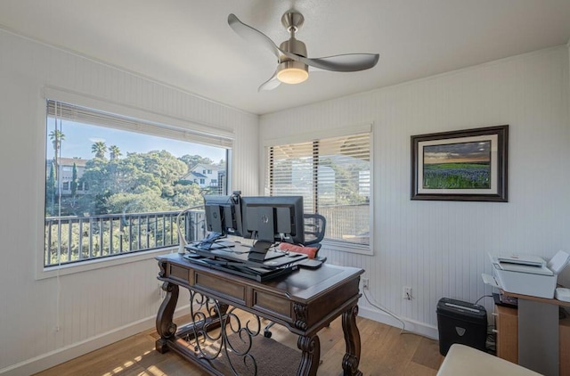 office space with hardwood / wood-style floors and ceiling fan