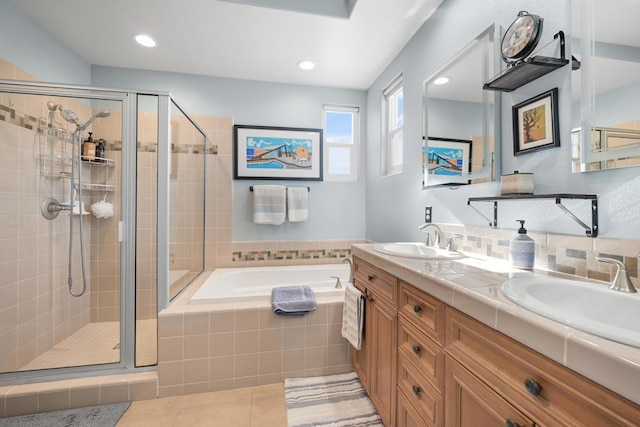 bathroom featuring vanity, tile patterned floors, and plus walk in shower