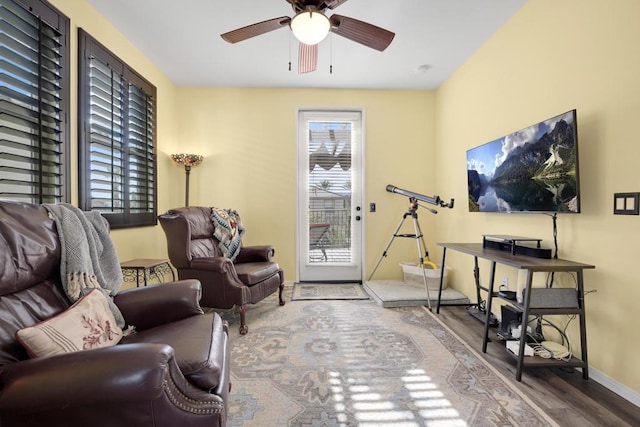 living room with ceiling fan and hardwood / wood-style flooring