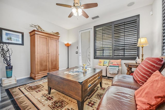 living room with ceiling fan and hardwood / wood-style flooring