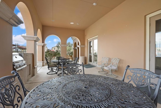 view of patio / terrace featuring french doors, an outdoor kitchen, and grilling area