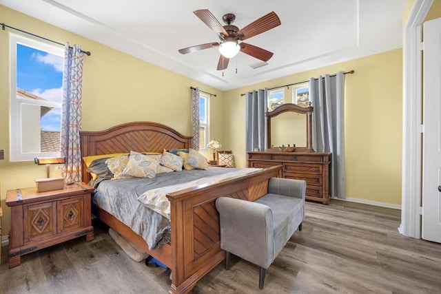 bedroom featuring ceiling fan and hardwood / wood-style flooring