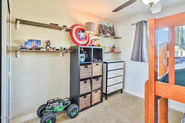 bedroom featuring ceiling fan and light colored carpet