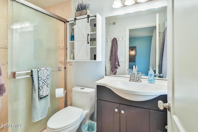 bathroom with toilet, walk in shower, and vanity