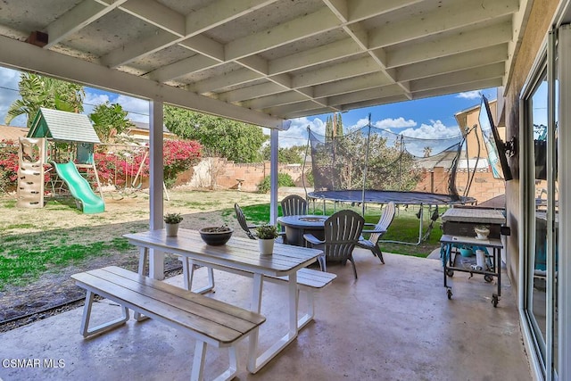 view of patio / terrace featuring a playground and a trampoline