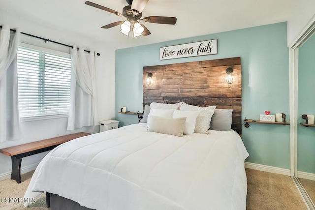 bedroom with ceiling fan and light colored carpet