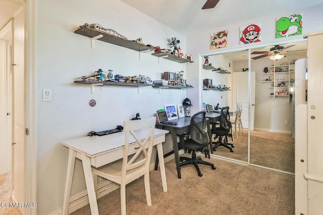 office space featuring ceiling fan and carpet