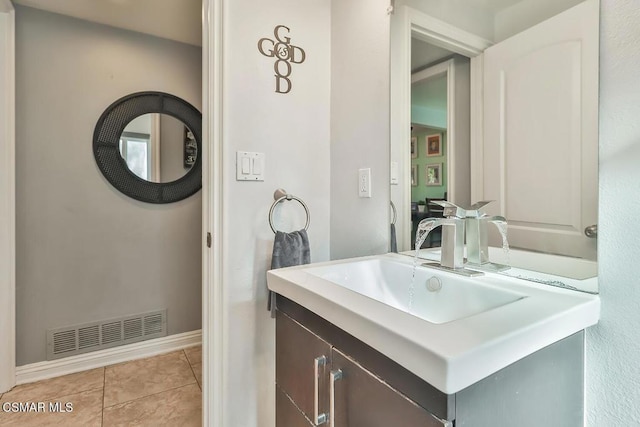 bathroom featuring vanity and tile patterned flooring