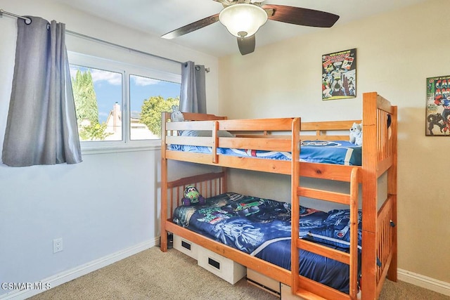 bedroom with ceiling fan and carpet floors