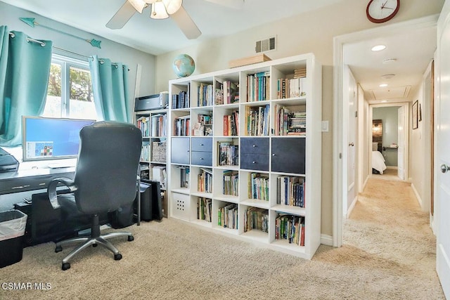 carpeted office with ceiling fan