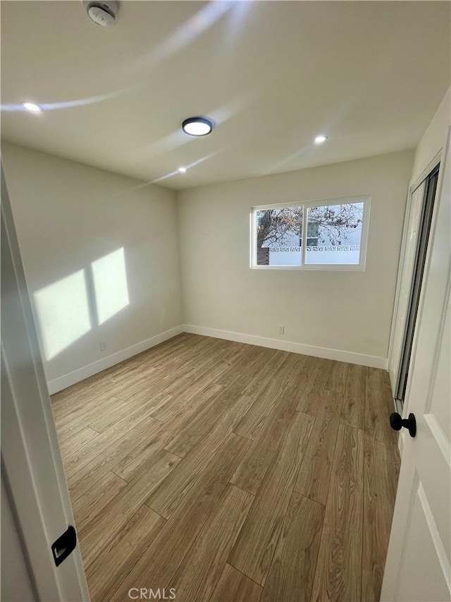 unfurnished room featuring light hardwood / wood-style flooring