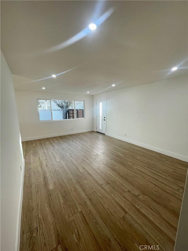 spare room featuring hardwood / wood-style floors