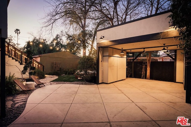 view of patio terrace at dusk