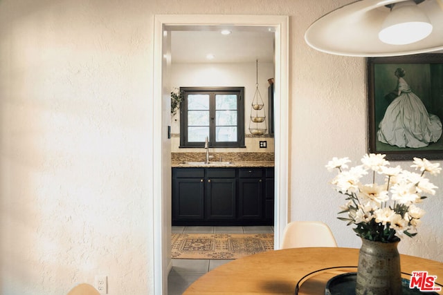 bathroom featuring tile patterned flooring and vanity