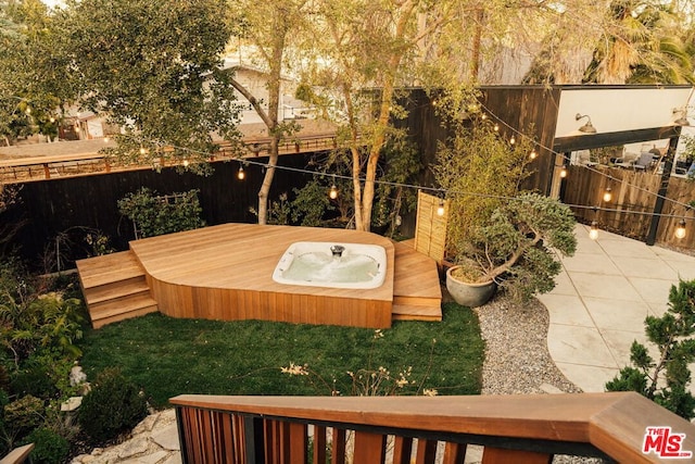 view of yard featuring a jacuzzi and a patio