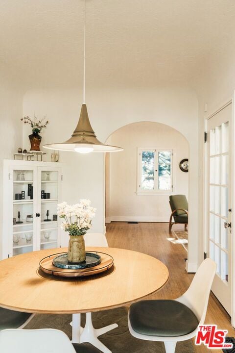 dining space with light hardwood / wood-style flooring