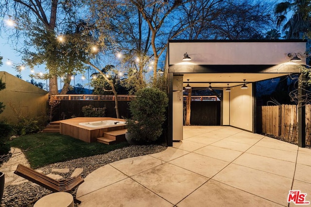 view of patio with a jacuzzi