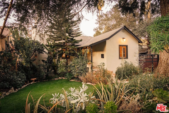 view of home's exterior with a lawn