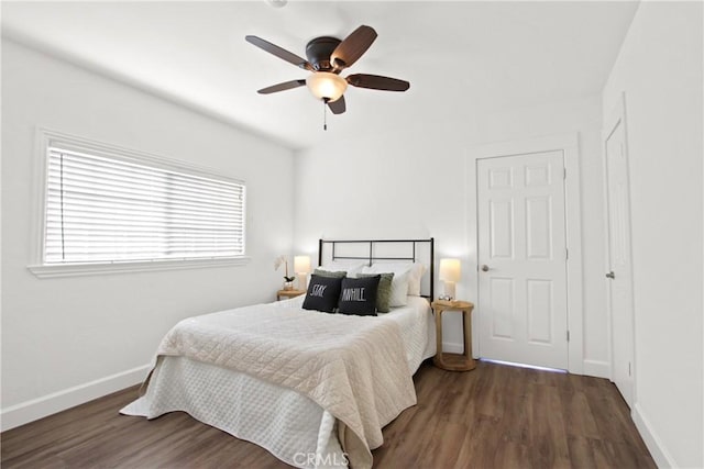 bedroom featuring ceiling fan and dark hardwood / wood-style floors