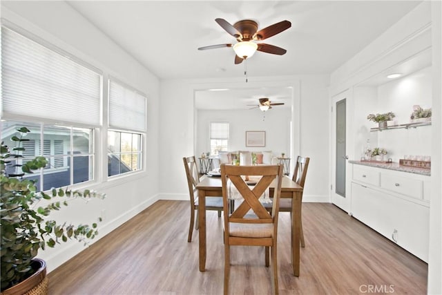 dining space featuring ceiling fan and light hardwood / wood-style flooring