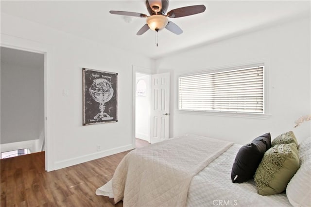 bedroom featuring ceiling fan and hardwood / wood-style flooring