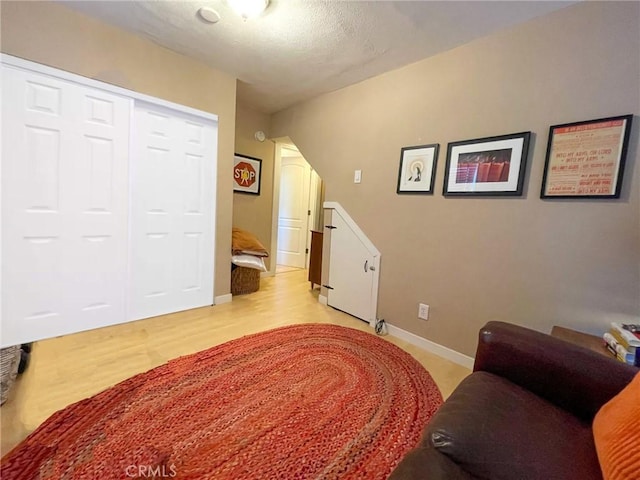 sitting room featuring light hardwood / wood-style flooring