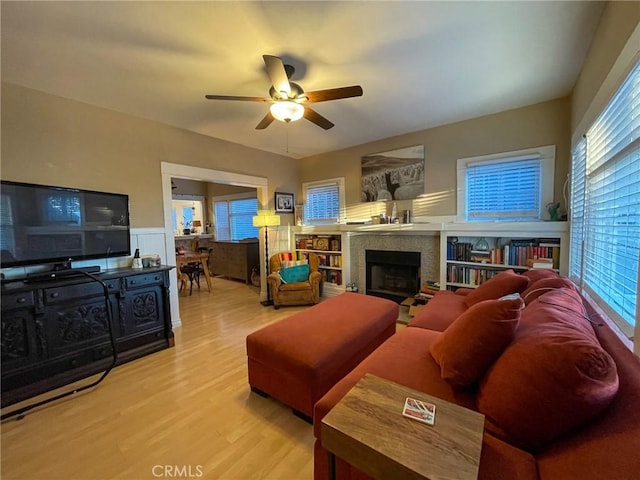 living room featuring ceiling fan and wood-type flooring