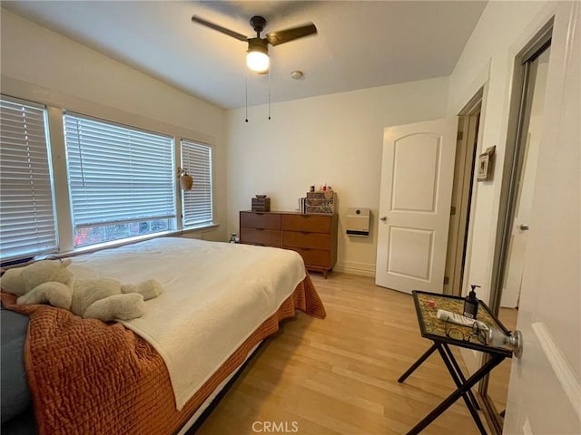 bedroom featuring ceiling fan and light hardwood / wood-style flooring