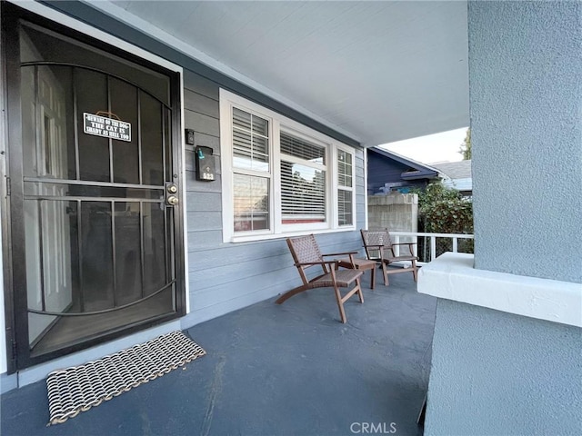 doorway to property with a porch