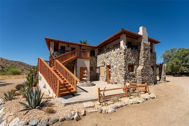 back of house featuring a mountain view