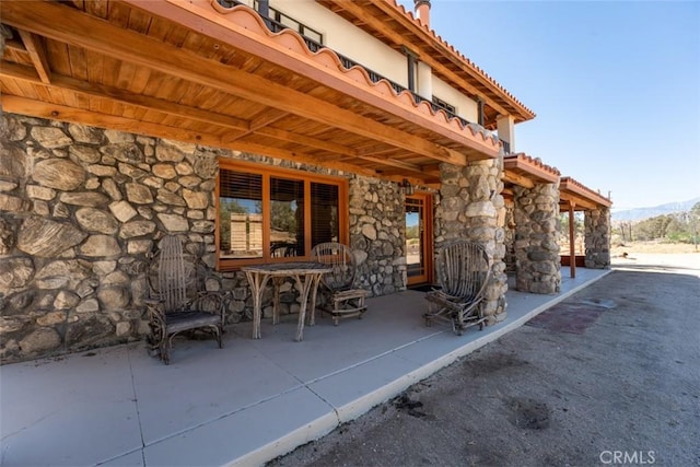 view of patio / terrace featuring a mountain view