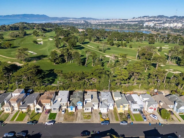 drone / aerial view featuring a water and mountain view