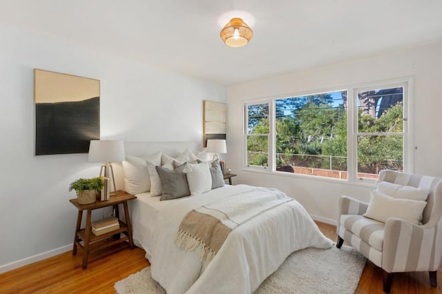 bedroom with wood-type flooring