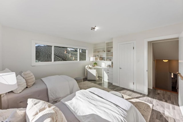 bedroom with wood-type flooring