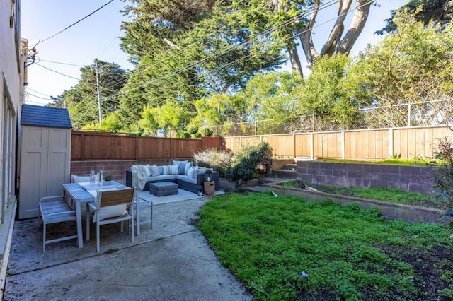 view of yard featuring an outdoor living space, a patio area, and a storage shed