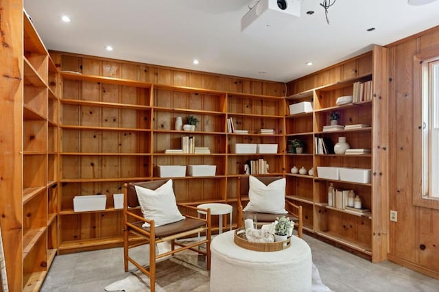 sitting room with wood walls