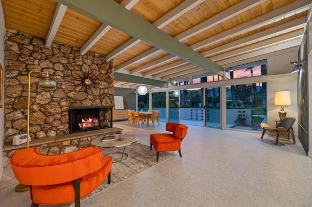 living room with a fireplace and beamed ceiling