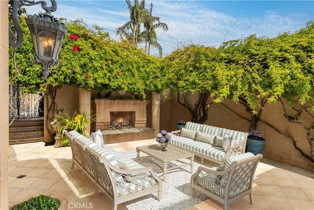 view of patio / terrace featuring an outdoor living space with a fireplace