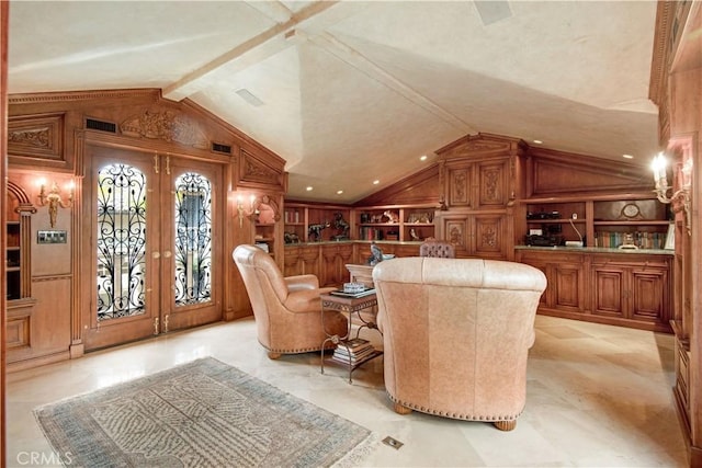 sitting room featuring lofted ceiling, built in features, wooden walls, and french doors