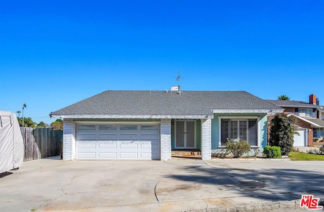 ranch-style home featuring a garage