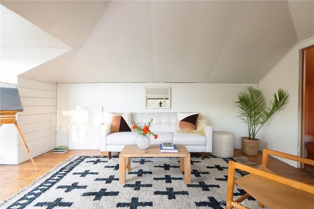 bonus room with lofted ceiling and wood finished floors