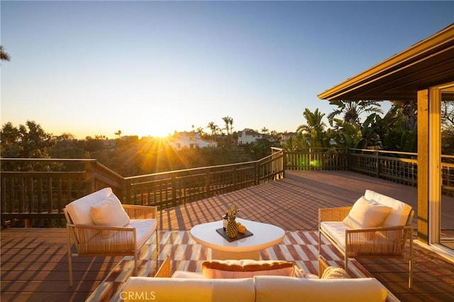 wooden deck with an outdoor living space