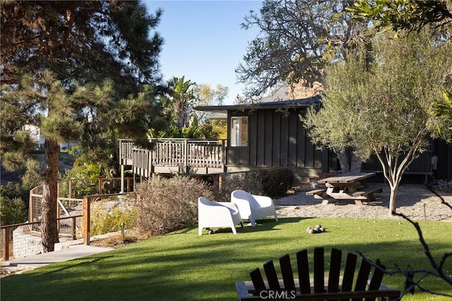 view of yard featuring a wooden deck